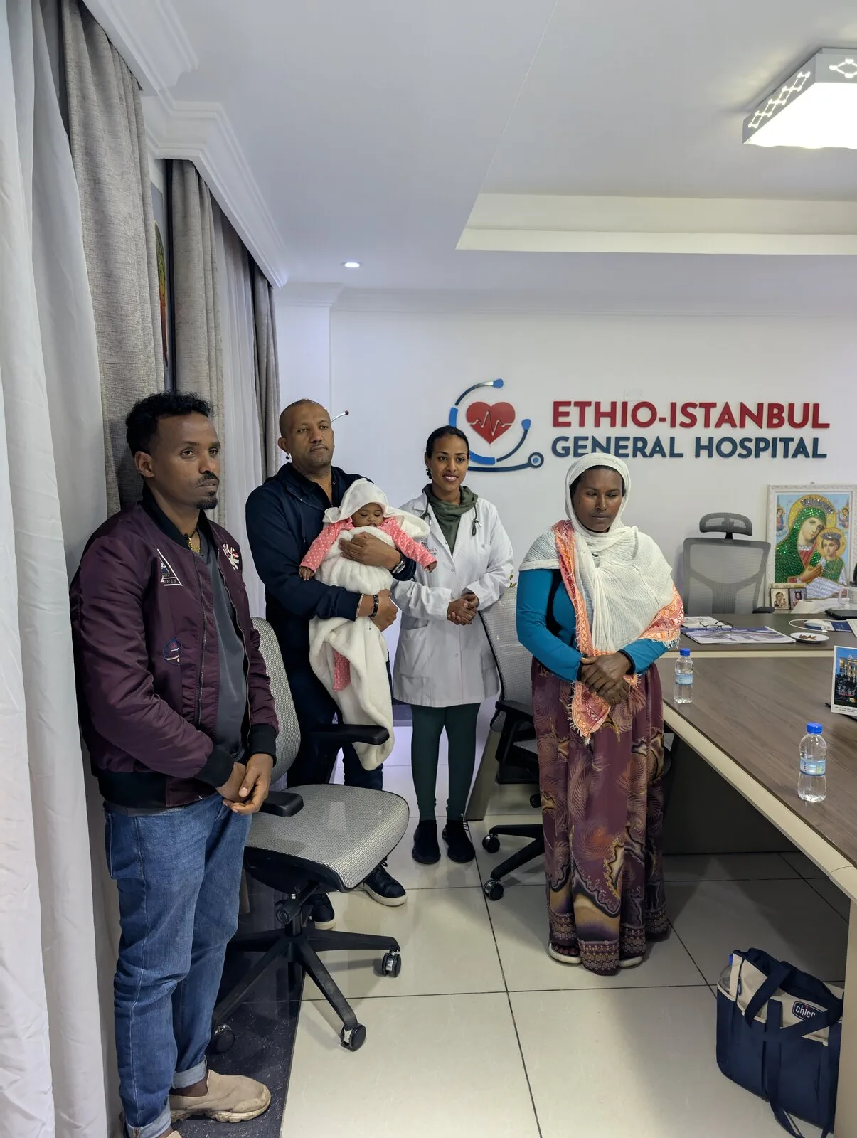 Family members with the baby after successful surgery