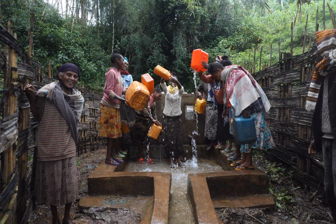 Ethiopian community gathering water at a well funded by Keffa Coffee